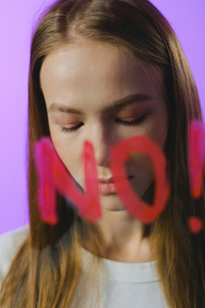 A woman with NO written across her