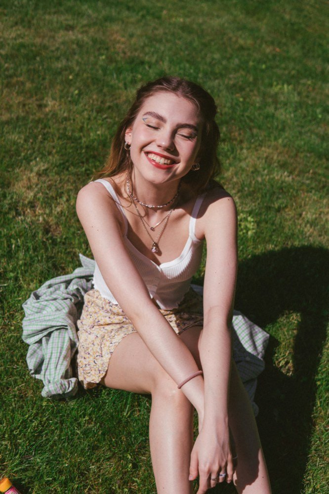 A woman lying in the sun, laughing