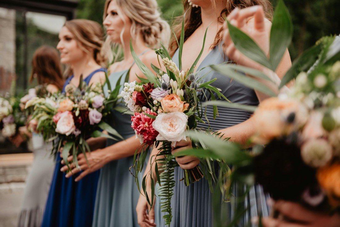 Women holding their flowers together