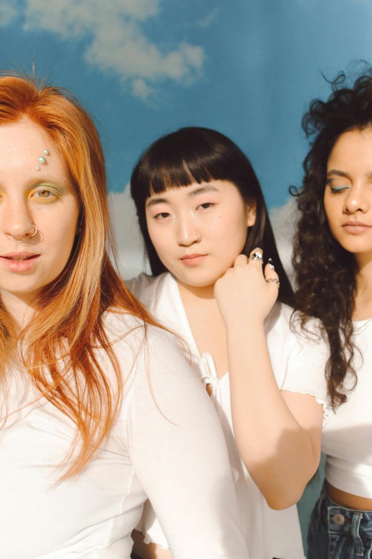 Three women, side by side
